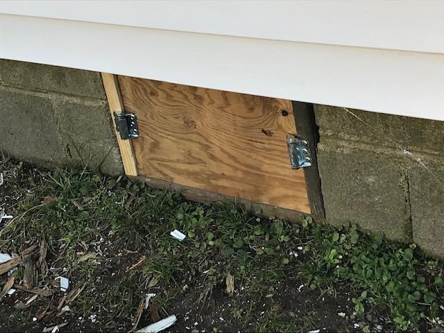 Access door to a crawlspace under a house